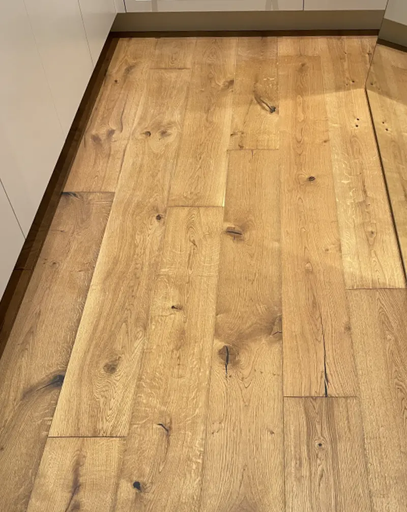 An interior installation photo showcasing the Desna rustic grade wood flooring