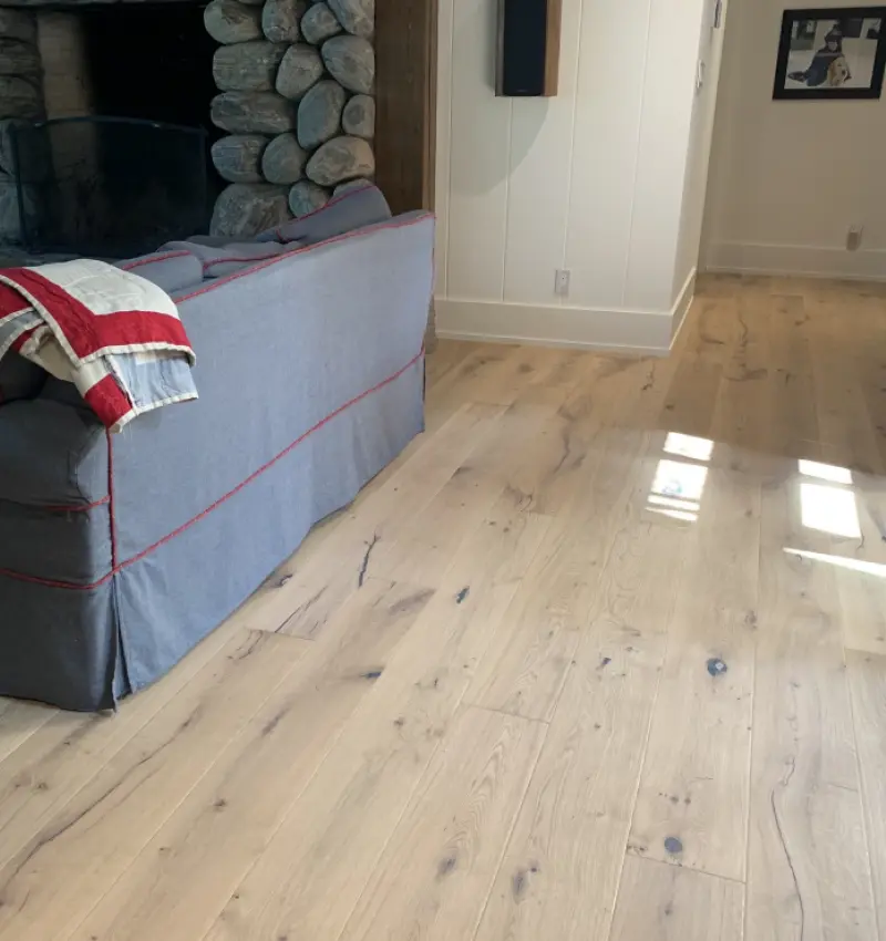 An interior installation photo showcasing the Styr rustic grade wood flooring