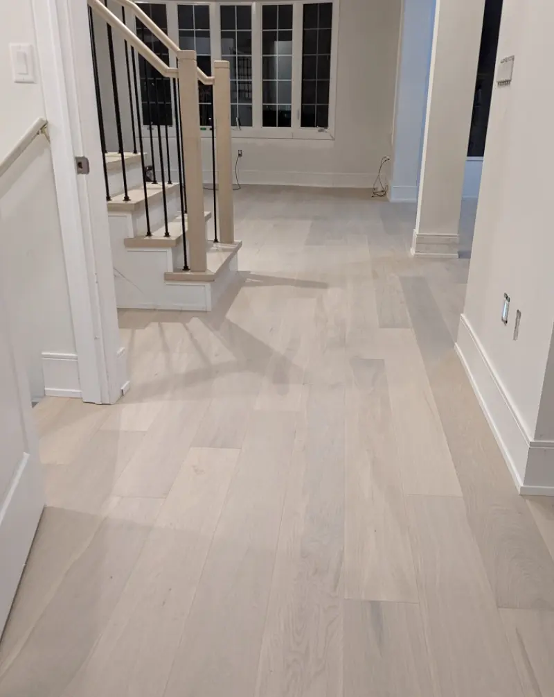 An interior installation photo showcasing the Vovcha select and better grade wood flooring