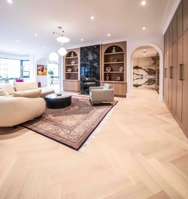 An interior installation photo showcasing the Eir herringbone wood flooring pattern