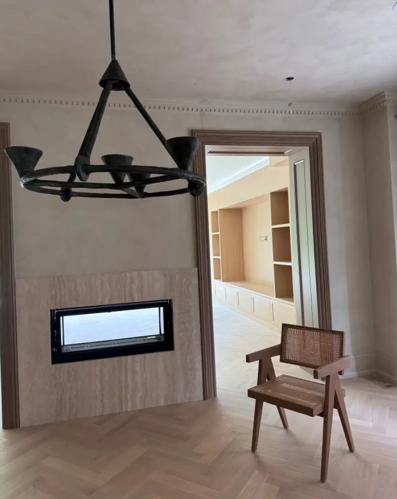 An interior installation photo showcasing the Vali herringbone wood flooring pattern